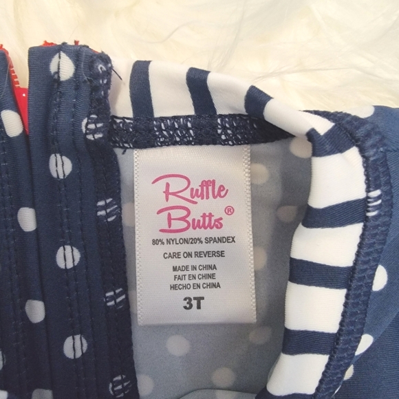 Ruffle Butts girls swimsuit, long sleeve one piece, red white & blue with bows - Picture 2 of 3